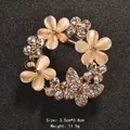 Elegant gold-plated cat eye stone flower brooch featuring a sparkling rhinestone butterfly - Wreath and Butterfly Shape (XD9162)