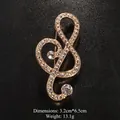 Elegant musical note brooch with sparkling rhinestones in a gold finish - Gold/Full Rhinestone Large