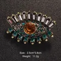 Vintage eye-shaped brooch with amber and emerald green rhinestones, gold-toned - Evil Eye Style (XD8330-2)