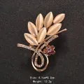 Elegant gold-tone leaf brooch featuring cat eye stones and sparkling rhinestones. - Leaf and Floral Shape (XD9170)