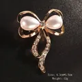 Elegant gold-finished bow brooch featuring white teardrop pearls and rhinestones - Rhinestone Tassel Bowknot Double Pearl (XD9395-2) / 4.3x5.5cm / Tassel Pearl Bowknot (Gold)