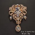 Vintage ornate gold-toned crystal brooch pin with wings design and teardrop pendant - Baroque Crystal Large Wing Style (XD7720)