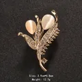 Elegant floral cat eye stone brooch with gold plating and sparkling rhinestones for women - Double Cat Eye Leaf (XD9175)
