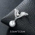 Elegant silver-toned brooch featuring a hanging white pearl and sparkling rhinestones - Wing Style with Pearl (XD9367) / Silver