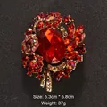 Elegant vintage red crystal brooch with flower and wing design in a gold-tone finish - Red Crystal Floral Wing Style (XD6388)