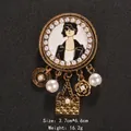 Elegant gold-tone brooch with portrait and quilted bag charms - Elegant Camellia Pendant Style (XD8443)