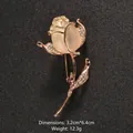 Elegant rose flower brooch with cat-eye stone and rhinestones in polished golden finish - Rose Shape (XD451)
