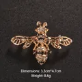 Elegant honey bee brooch pin with sparkling black and white rhinestones in gold-tone finish - Jeweled Bee Style (XD8197-1)