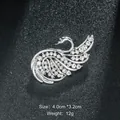 Elegant silver-tone swan brooch encrusted with sparkling white crystals on black background - Swan Shape (XD9145) / Silver