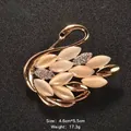 Elegant golden swan brooch featuring opal cat's eye stones and sparkling crystal accents - Swan Shape (XD456)