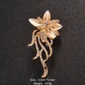 Elegant cat eye stone flower brooch with rhinestones and gold-tone finish, size 3.0x6.4cm. - Floral Tassel Brooch (XD457)
