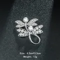Elegant silver-tone dragonfly brooch featuring sparkling rhinestones and lustrous pearls - Dragonfly Shape (XD8107) / Silver