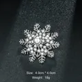 Elegant silver snowflake brooch adorned with white pearls on a black textured background - Snowflake Shape (XD8856) / Silver