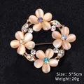 Elegant golden flower brooch featuring cat-eye stone petals and colorful rhinestone accents - Four-Petal Wreath (XD9164)