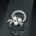 Elegant silver-tone circular bow brooch featuring white pearls and sparkling crystals - Ring Bowknot Shape (XD7887) / Silver