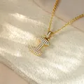 Close-up of gold iced-out 'I' letter pendant necklace with sparkling cubic zirconia stones - Letter I / Champagne Gold