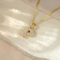 Detailed close-up view of a gold initial P necklace with shimmering crystal pavé design - Letter P / Champagne Gold