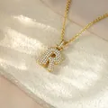Macro view of gold pavé-set lowercase letter r pendant with clear crystals - Letter R / Champagne Gold