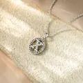 Dettaglio del ciondolo iniziale X in argento con zirconi micro-pave su fondo materico. - Collana X / Argento