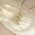 Close-up detail showing the iced out gold letter Z pendant of this hip hop style necklace - Letter Z / Champagne Gold