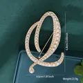 Elegant pearl-studded letter Q brooch in gold finish with precise size and weight details - Letter Q