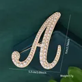 Elegant gold letter A brooch pin with pearl inlay decoration, 5.3x7cm size and 17g weight - Letter A