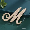 Elegant gold letter M brooch with pearl embellishments for women's wear - Letter M