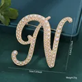 Retro gold-toned metal brooch shaped as letter N with white pearls, 5cm x 5.5cm size - Letter N