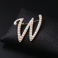 Vintage gold-tone letter W initial brooch pin with elegant white pearl accents - Letter W
