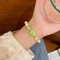 Pulsera de cuentas de cerámica color macaron con colgante de flor verde en la muñeca - Estilo Estrella (S459 Verde Estrella) / Estrella Verde
