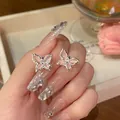 Elegant pink butterfly stud earrings featuring silver frames and sparkling zircon stones - Butterfly Style (A1659 Pink) / Pink