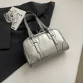 Stylish silver underarm shoulder bag with large capacity and buckle straps. - Silver