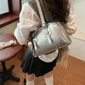 Stylish silver metallic shoulder bag with baseball charm in a modern chic fashion style - Silver With Pendant