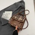Zaino vintage a quadri da donna con finiture in pelle marrone e dettagli dorati - Marrone