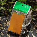 Translucent orange resin Gua Sha tool in retail packaging for face and neck massage - Solid Color Type B