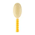 Ergonomic twisted handle hairbrush for scalp massage and detangling in vibrant yellow - Twisted Air Cushion Brush - Yellow