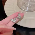 Detailed close-up of S925 silver needle butterfly stud earrings with sparkling zircons - Full Rhinestone Butterfly Style (A803 Silver)