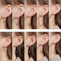 Comparison of 3cm to 7cm gold and silver hoop earrings on model's ear for size guide - Minimalist Plain Hoop (E2455) / 3cm / Gold