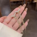 Elegant asymmetric long tassel earrings with sparkling star details for modern women. - Star Flare Tassel Style (E5215)