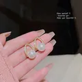 Elegant gold teardrop pearl earrings with S925 silver needles for a vintage look. - Hollow Drop Pearl Style (A1130 Gold)