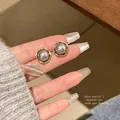 Elegant S925 silver grey pearl stud earrings with retro gold-rimmed textured frame - Grey Pearl Base Style (A1412 Gold)