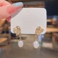 Elegant S925 silver needle gold butterfly earrings with pearl drop pendants - Hollow Butterfly Artificial Pearl Style (A341)