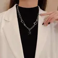 Minimalist silver titanium steel chain necklace with square black pendant on model. - Geometric Style (X786 Silver)
