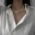 Elegant gold chunky curb chain necklace in titanium steel worn with white shirt - Gold Trendy Style (X427 Gold)