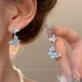 Elegant blue butterfly dangle earrings with sparkling zirconia and silver needles. - Double Layer Iridescent Butterfly Style (A1586 Silver) / Silver