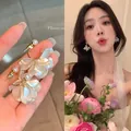 Exquisite white petal flower earrings featuring elegant pearls and gold hooks for women - Sweet Petal Pearl Style (A2526 Gold) / Gold