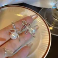 925 silver bow-knot stud earrings featuring high-luster white pearls for women - Bowknot Pearl Stud Earrings (A1651) / Silver
