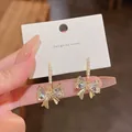 Elegant crystal bow earrings with dainty pearls and S925 silver needle for women. - Heart-Shaped Crystal Bowknot Style (A645)