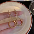 Elegant gold teardrop earrings featuring a sparkling zircon bow and a beaded geometric loop - Bowknot Waterdrop Drop Style (E5419) / Gold