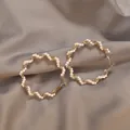 Elegant gold plated twisted hoop earrings adorned with small white pearls for women - Pearl Wrapped Hoop Earrings (E775) / Gold